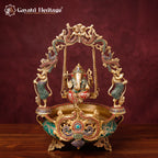 Brass Ganesh Urli with Swing | Stone Studded Golden Flower Floating Bowl | Lord Ganesha Jhula Decor