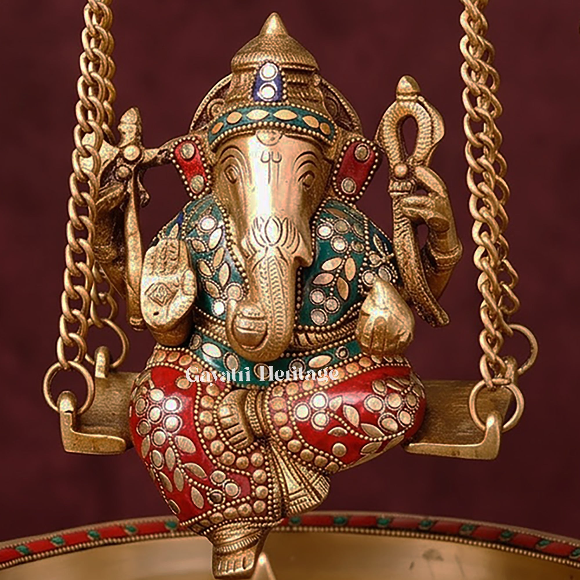 Brass Ganesh Urli with Swing | Stone Studded Golden Flower Floating Bowl | Lord Ganesha Jhula Decor